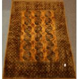 Afghan Bokhara gold ground rug carpet, repeating guls, geometric boarders, labelled,