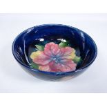 Moorcroft Hibiscus pattern bowl on blue ground, with impressed marks and painted signature,