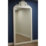 Large white finish wood framed bevelled mirror, rounded top with carved shell pediment,