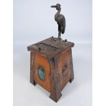 Arts and Crafts novelty copper effect stork cigarette dispenser with a Ruskin style cabochon,