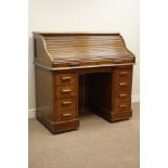 Early 20th century oak tambour roll top desk, fitted interior, six drawers with slides, W121cm,