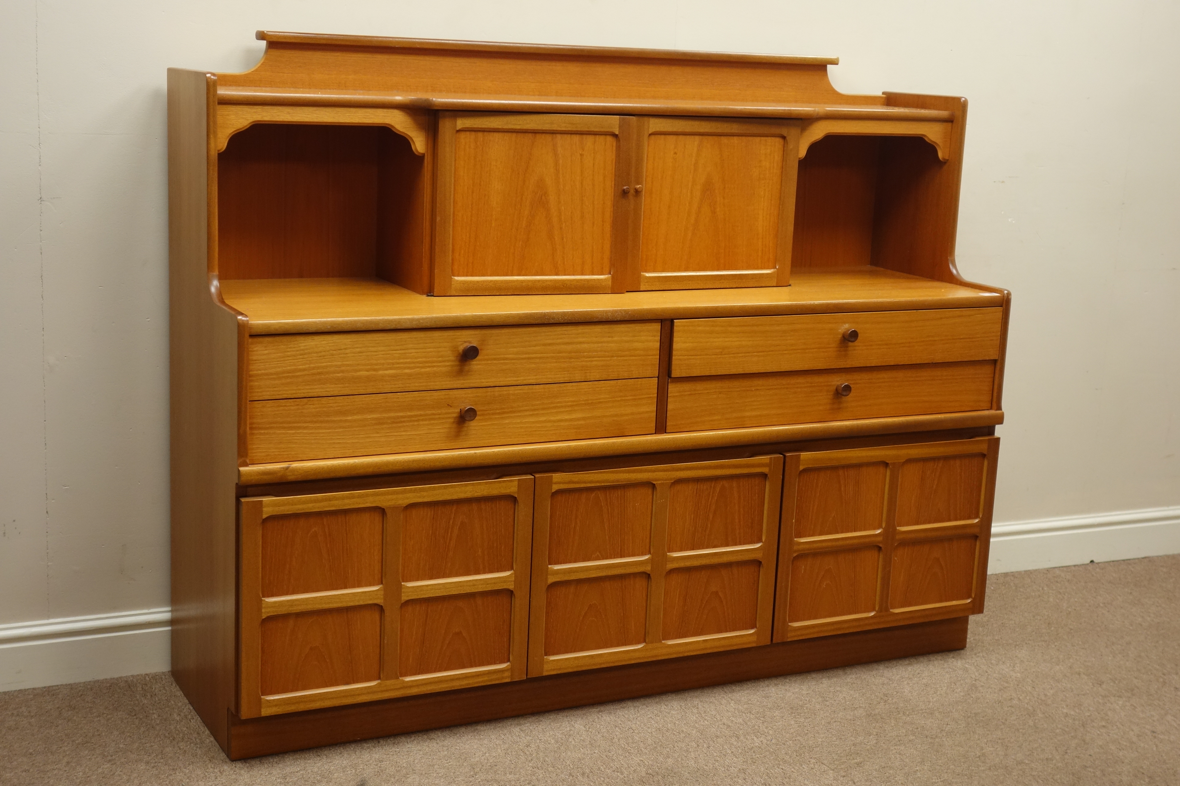 Nathan teak wall unit, four drawers and three cupboards, raised double cupboard, W153cm, H118cm,