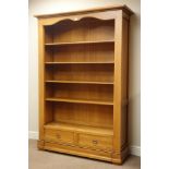 Barker & Stonehouse light oak open bookcase fitted with two drawers, W129cm, H188cm,