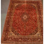 Large Persian Kashan red ground rug carpet, interlacing stylised floral field with medallion,