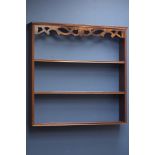 Small mahogany three tier plate rack with fret work frieze,