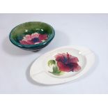 Moorcroft Hibiscus pattern ashtray, L16cm and a Moorcroft Anemone pattern small bowl, D11.