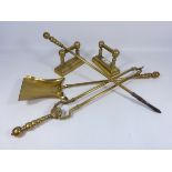 Three piece brass companion set with a pair of brass firedogs (5) Condition Report