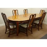 Chinese extending dining table with two additional leaves and a set of six chairs including two