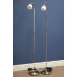 Two burnished metal adjustable standard lamps,