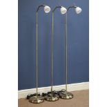 Three burnished metal adjustable standard lamps,