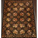 Black woollen rug carpet with floral decoration,