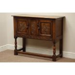 Medium oak hutch type cupboard with carved detail to doors and frieze,