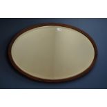 20th century inlaid mahogany oval inlaid wall mirror,