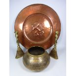 Pair of Eastern brass candlesticks a similar bowl and a large copper plaque with embossed lion,