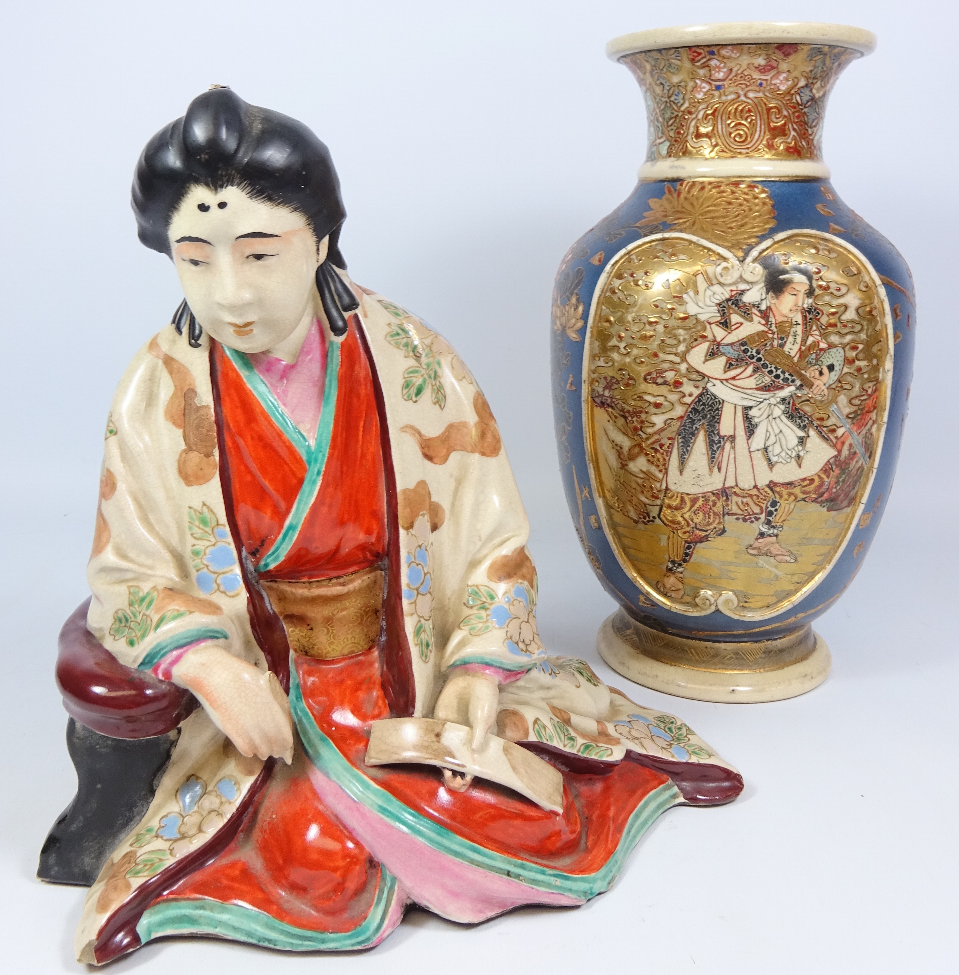 Japanese Meiji period pottery figure of a seated man,