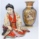 Japanese Meiji period pottery figure of a seated man,