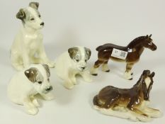 Russian animal figurines - two seated puppies and a terrier dog and two bay horses,