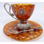 Russian white metal and amber cup, saucer and matching tea spoon,