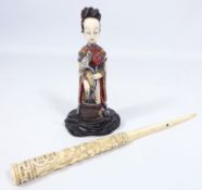 Early 20th Century Japanese stained ivory Okimono of a lady with a lotus flower and a Meiji period