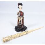 Early 20th Century Japanese stained ivory Okimono of a lady with a lotus flower and a Meiji period