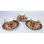 Two Royal Crown Derby Imari pattern coffee cans and saucers,