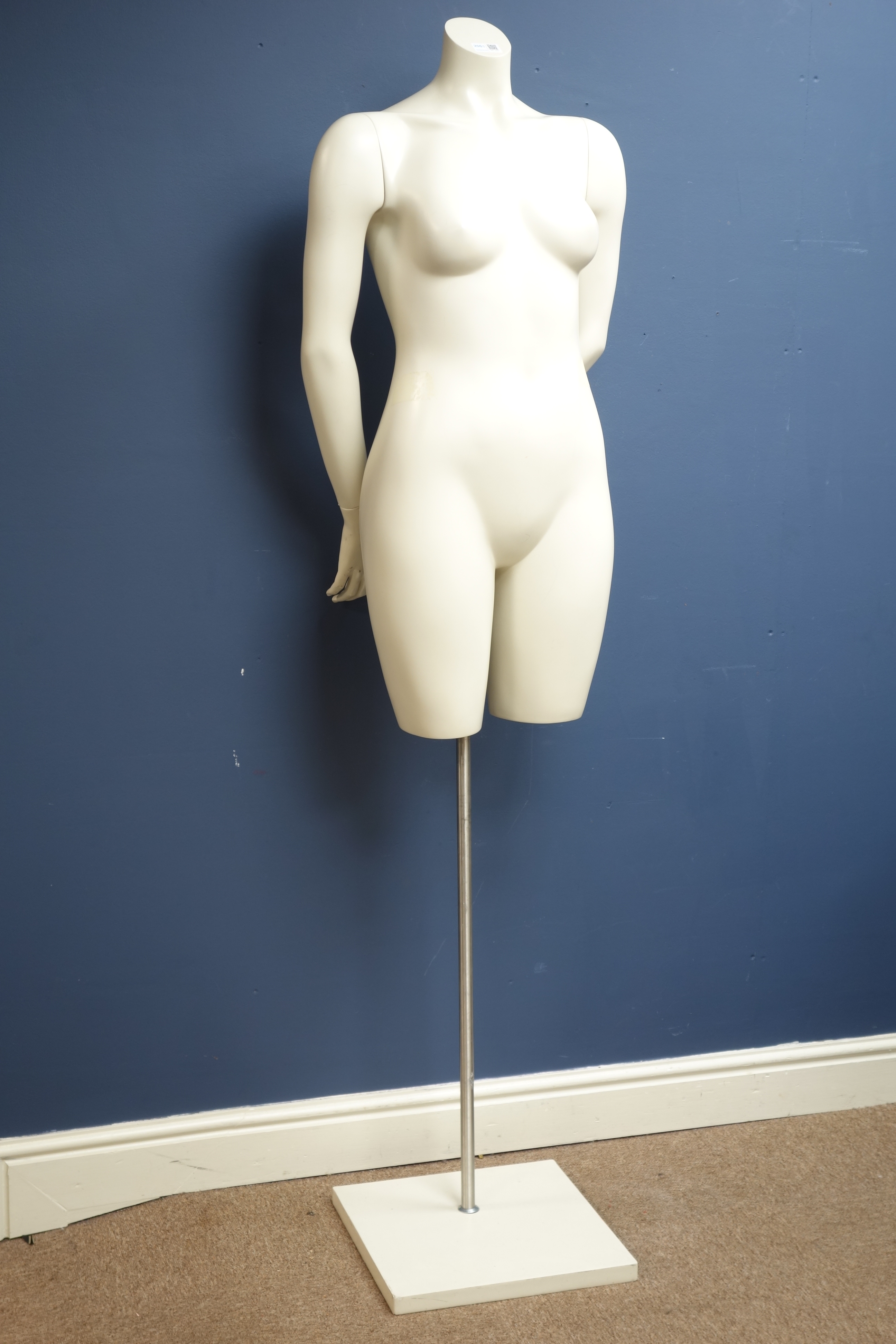 Half female adjustable mannequin on stand