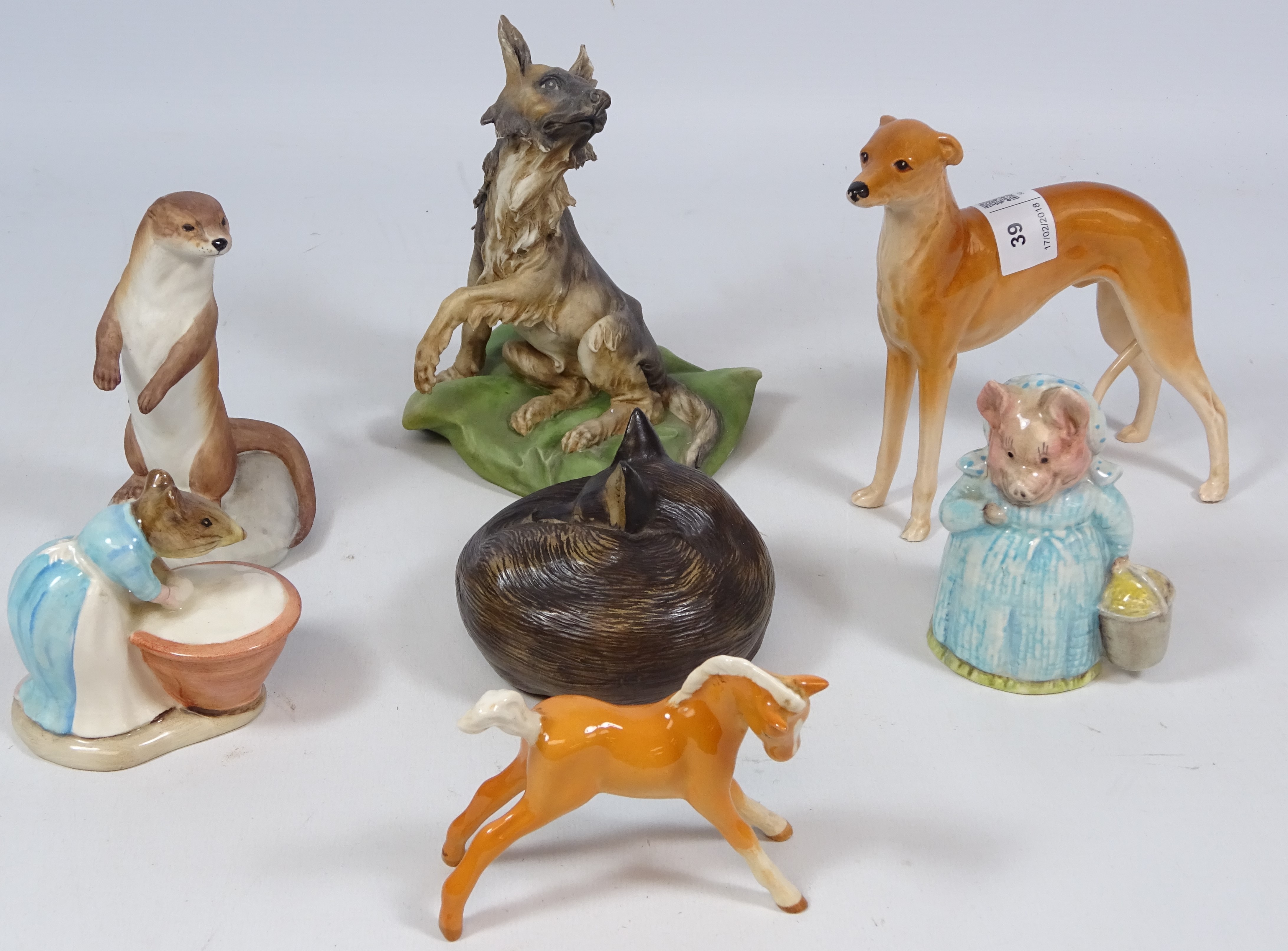 Poole pottery fox, Beswick foal, Capodimonte dog, two Beswick Beatrix Potter figures,