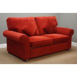 Two seat metal action sofa bed upholstered in red fabric,