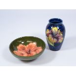 Small Moorcroft Lily pattern vase on blue ground, H10.