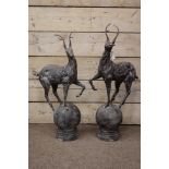 Pair cast metal garden stags on spherical mounts, figures/gate post finials,