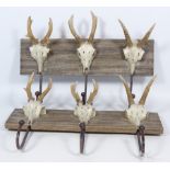 Two 'skull' three hook coat racks, W34cm Condition Report <a href='//www.