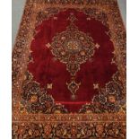 Persian Kashan rug carpet, maroon field with large floral central medallion,