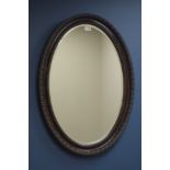 Edwardian oval mirror, moulded frame, bevelled glass,