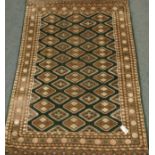 Persian green ground rug, repeating Gul design,