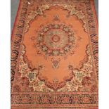 Persian style rug/carpet, red ground with central rosette medallion,