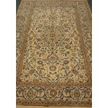 Persian fine Kashan cream ground rug, with blue interlacing floral field,