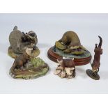 Four Border Fine Arts Otter sculptures and a sculpture of Playing Badgers,