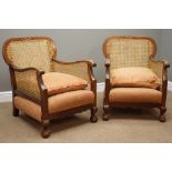 Pair early 20th century mahogany bergere upholstered armchairs,