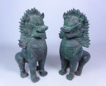 Pair of Burmese type patinated cast metal models of Temple Lions,