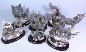Seven Wolf group sculptures, mostly with stands,