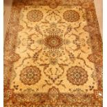 Large rug carpet, decorated with scrolling foliage and flower head motifs,