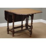 Early 20th century oak dining table, drop leaf top with moulded pie crust edge,