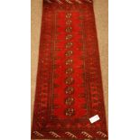 Small red ground Bokhara rug, 135cm x 54cm Condition Report <a href='//www.