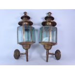 Pair of brass wall mounted coach type lanterns,