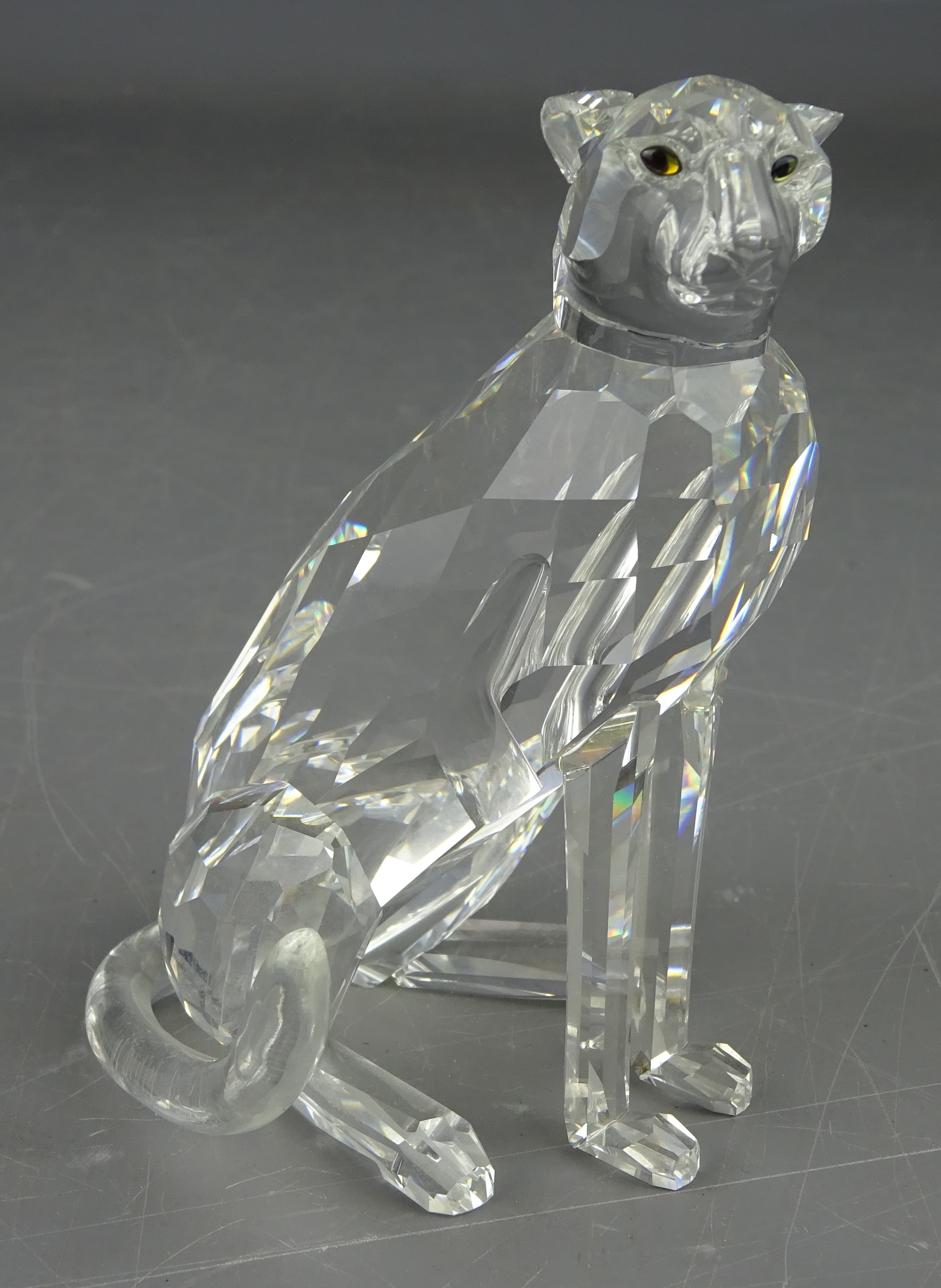 Swarovski crystal model of a seated Leopard, in original box,