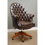 Swivel office armchair upholstered in buttoned leather,