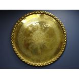 Large Eastern brass embossed circular wall plaque,