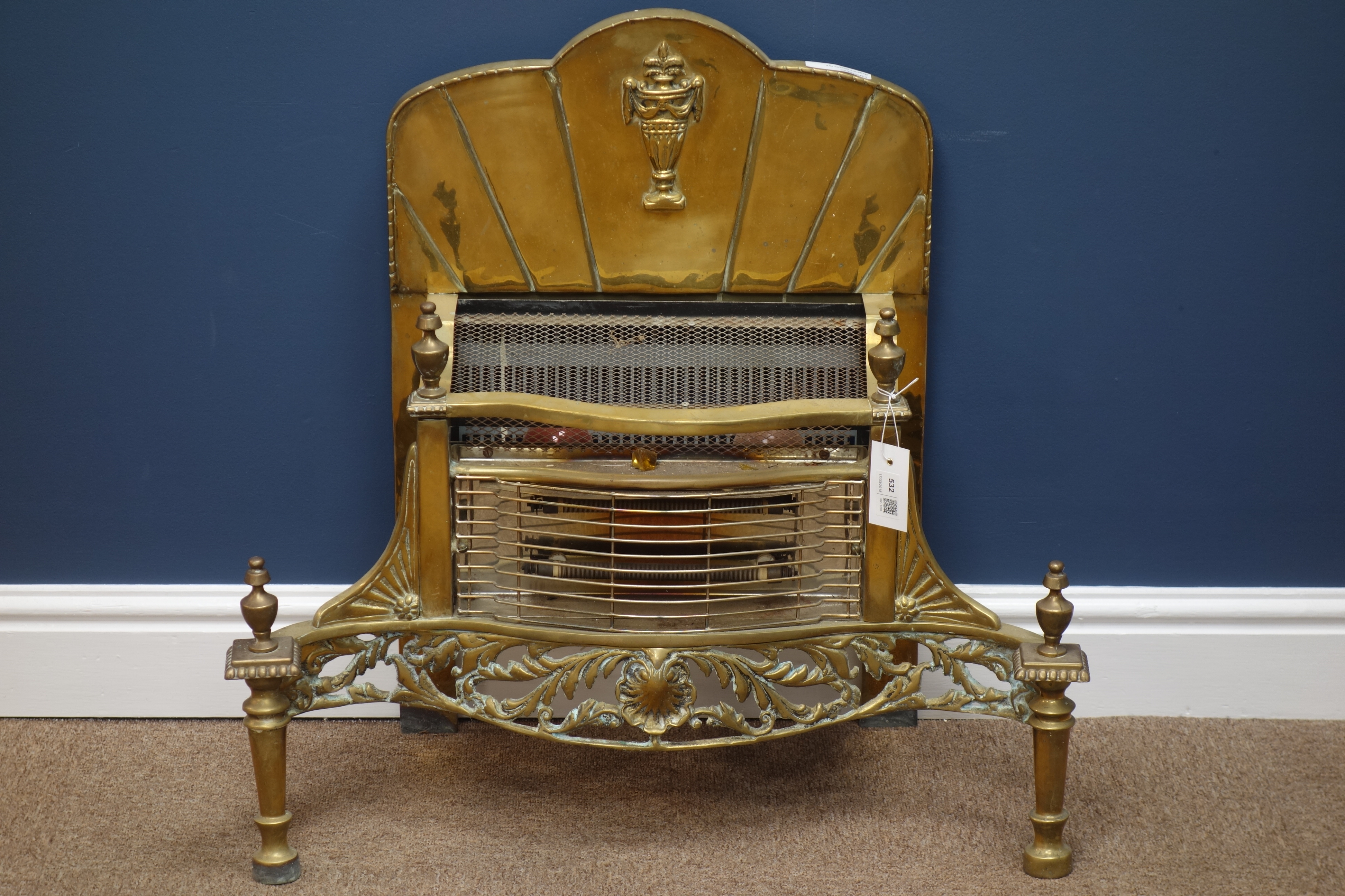 Regency style gilt metal electric fire basket, raised back with moulded urn motif, W67cm,