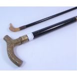 Vintage ebonised walking stick with brass handle and walking cane with bird moulded handle (2)