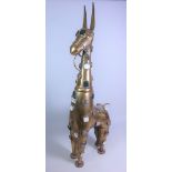 Large brass model of a long necked donkey, with polished stone bosses,